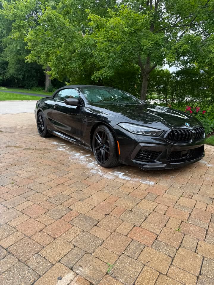 Black BMW M8 convertible with deep gloss after a wash